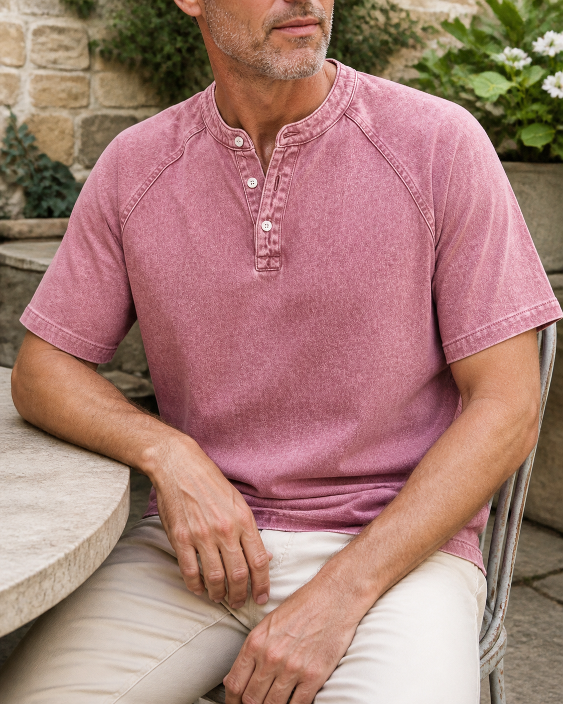 Faceless seated styling of the pink Saltwater short-sleeve Henley