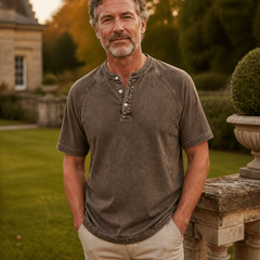 Brown Saltwater short-sleeve Henley styled outside a country house
