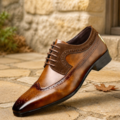 Alexander Prescott brown leather brogue shoes on autumn flagstones