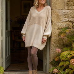 Bronte beige textured V-neck mini dress at a Cotswold doorway