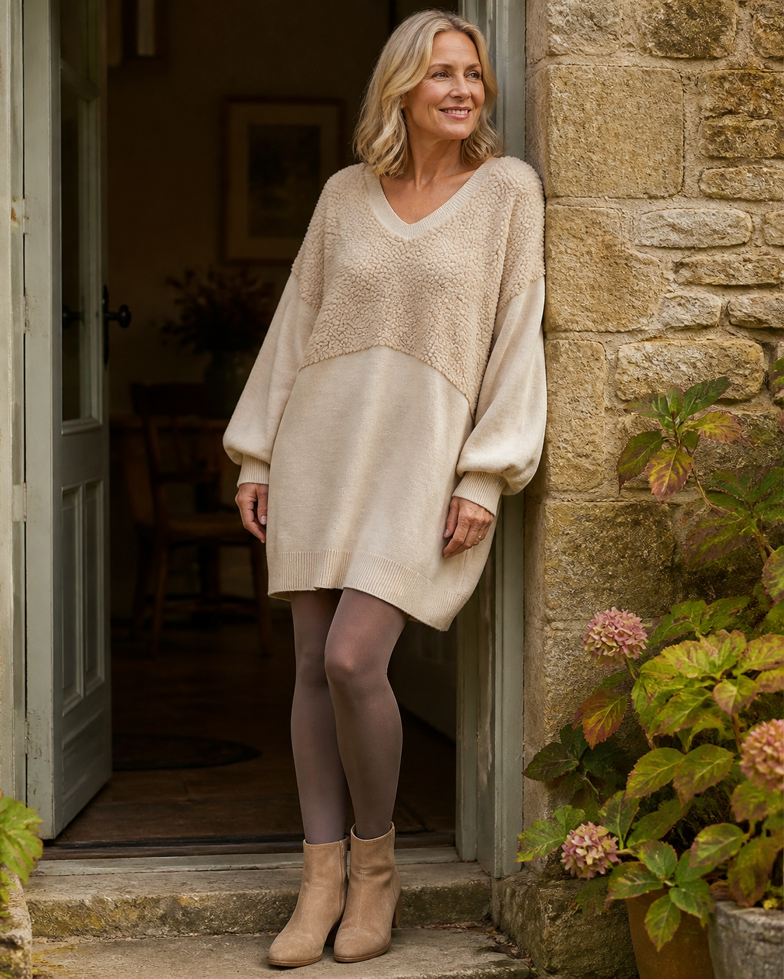 Bronte beige textured V-neck mini dress at a Cotswold doorway