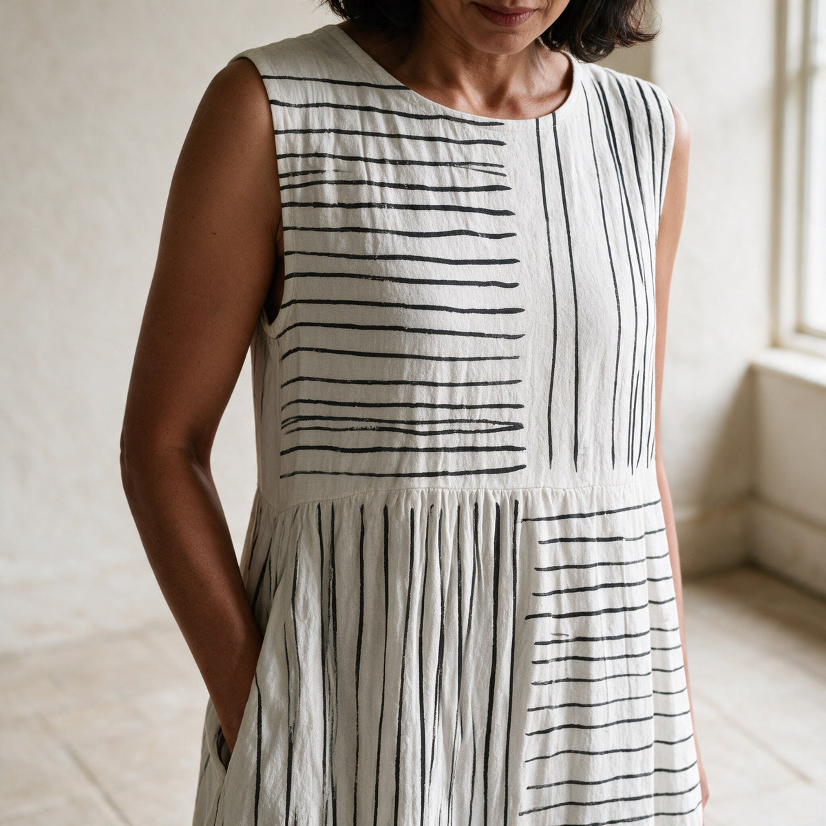 The Amara midi dress neckline, print and gathered-waist detail