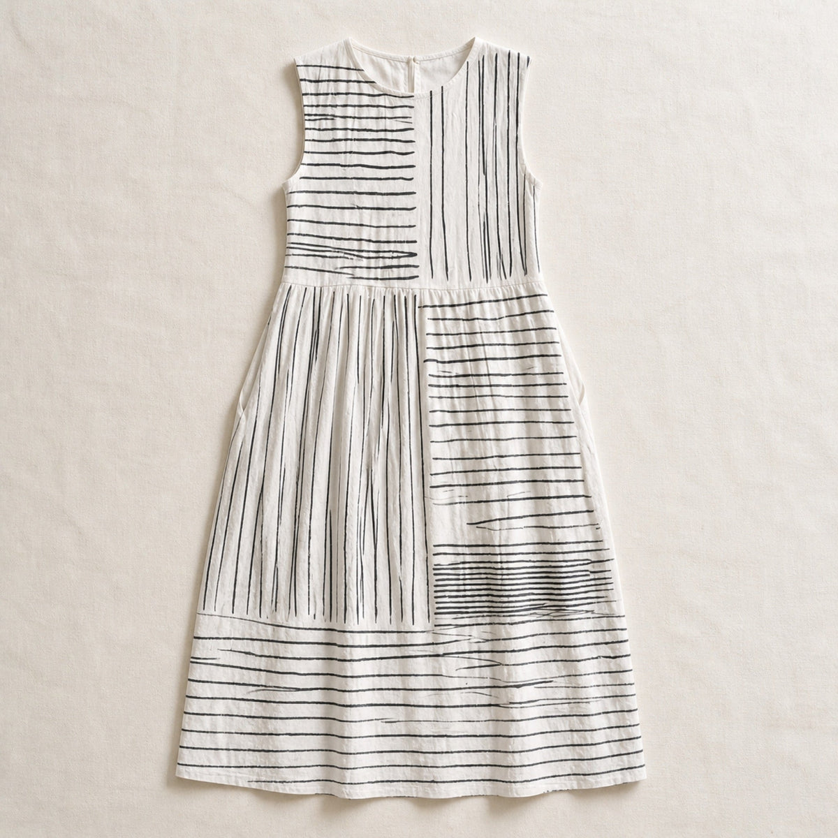 The Amara white and black line-print midi dress in a clean flat lay