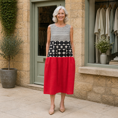 Rose wearing the multicolour Jane Colorblock Midi Dress, front full-body view outside the Cotswold stone boutique.