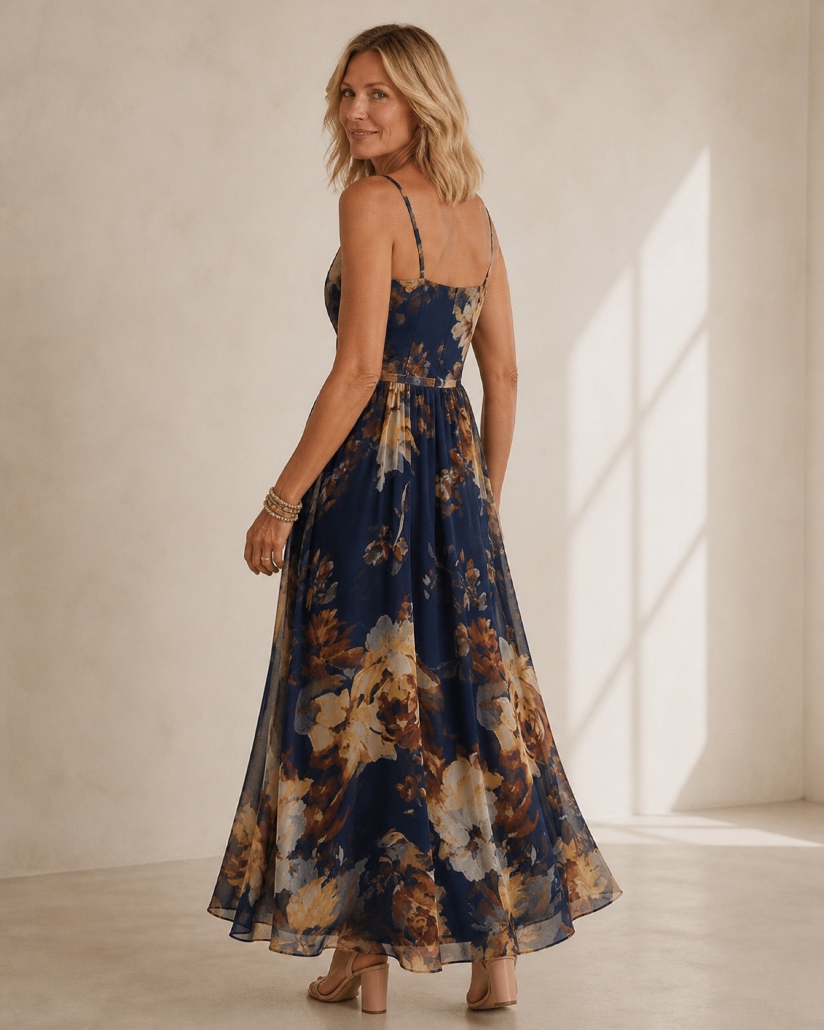 Navy chiffon floral maxi dress, back editorial view