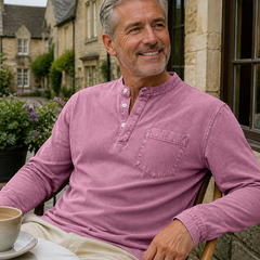 Pink Saltwater long-sleeve Henley styled outside a cafe