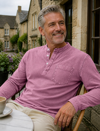 Pink Saltwater long-sleeve Henley styled outside a cafe