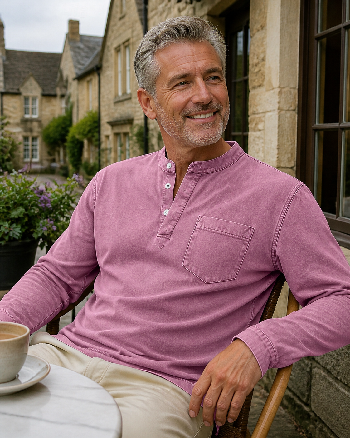 Pink Saltwater long-sleeve Henley styled outside a cafe